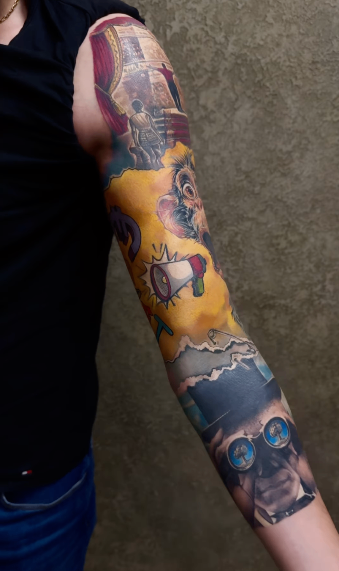 Colorful tattoo sleeve with collage-like imagery