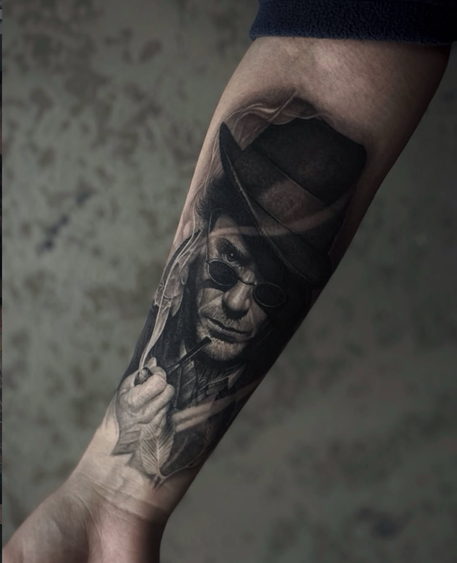 Black and grey portrait tattoo with noir styling